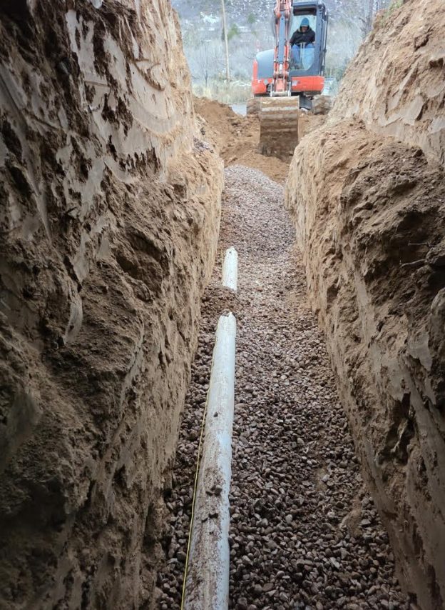 Sewer line trench with pipe ready for backfill
