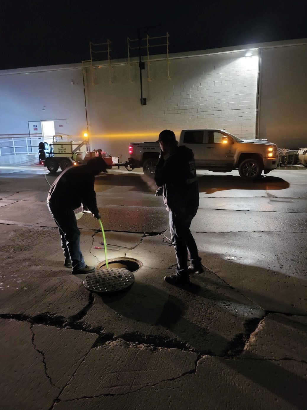 Elite Plumbing & Drains crew on a nighttime emergency call